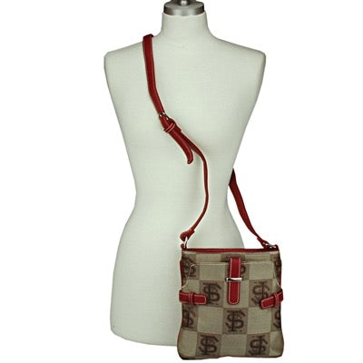 A mannequin torso displays a small, beige Signature Crossbody Chrissy 8983 FLORIDA STATE with a red strap and buckle details, adorned with a dollar sign pattern.