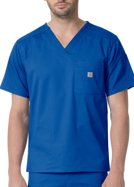 Man wearing Slim Fit 6 Pocket Top (Men's C16418) with a v-neck and short sleeves, featuring a small logo on the chest pocket.