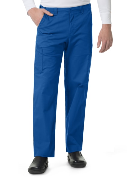 A man wearing Carhartt Ripstop Rugged Flex Straight Leg Cargo Pants (Men's C56418) and black shoes, standing with one hand in his pocket. Only the lower half of his body is visible.