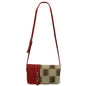 Red and beige designer shoulder bag with a long strap and a pattern featuring dollar sign motifs - The Navajo 8588 FLORIDA STATE