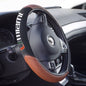 Close-up of a car steering wheel featuring a Miami Hurricanes Sports Grip Steering Wheel Cover with integrated controls and a partial view of the dashboard.