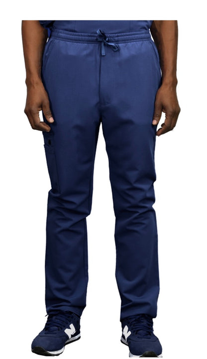 Front view of a person wearing WYND Men's Scrub Pants 830 with a drawstring and navy sneakers, cropped at the waist, visible from torso to feet.