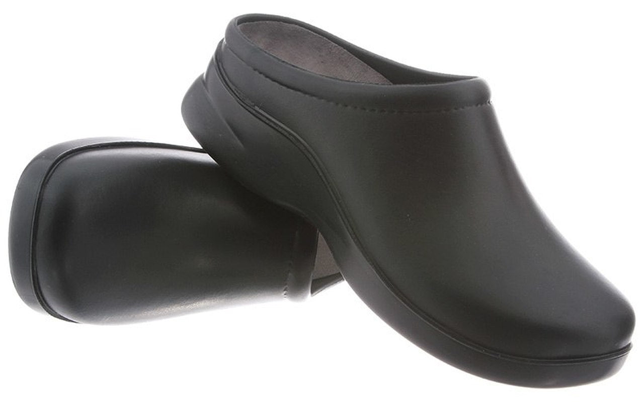 A pair of black, slip-on chef shoes isolated on a white background.