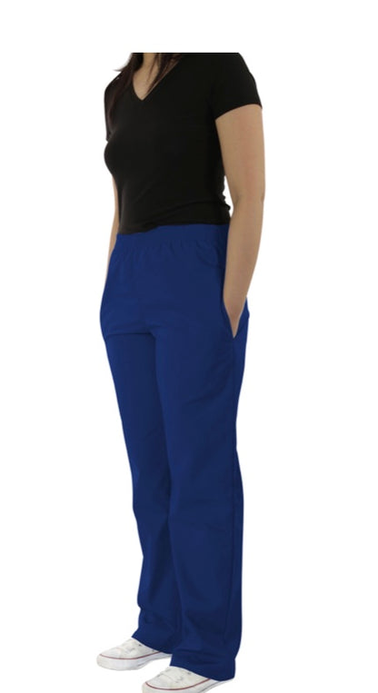 Woman standing in a black v-neck shirt and UltraSoft Unisex Classic Elastic Waist Scrub Pants 300C, paired with white sneakers, against a white background.