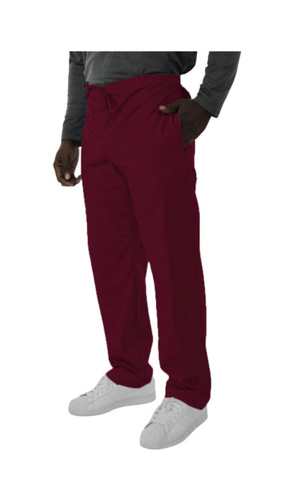 A man standing in UltraSoft Unisex Cargo 6-Pocket Pants 313C and white sneakers with a grey sweater tucked in at the front, left hand in pocket.