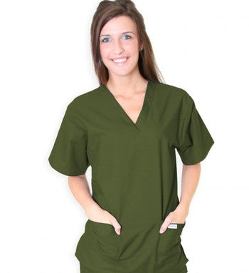 Woman in green scrubs standing against a white background, smiling at the camera.