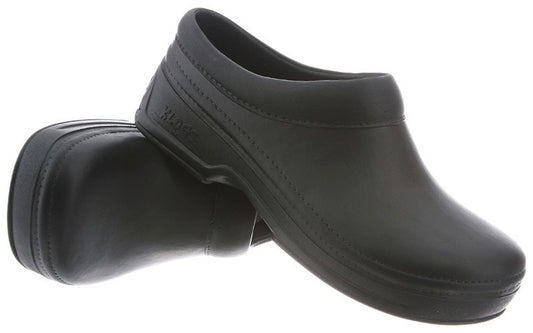 A pair of black leather clogs on a white background, left shoe resting on its side behind the right.