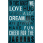 Jacksonville Jaguars Football and My Dog Sign with text "in this house we love, hug, laugh a lot, dream big, are grateful, have fun, cheer for the jaguars" on a blue wooden background.
