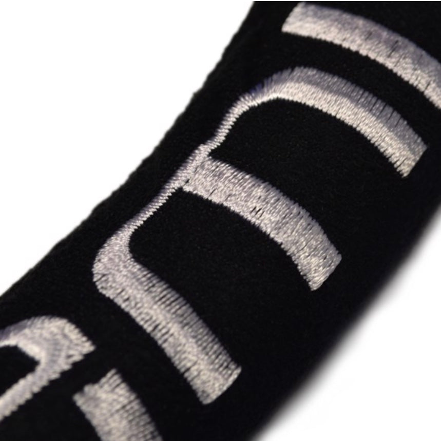 Close-up of a Miami Hurricanes Steering Wheel Cover with a reflective silver stripe design.