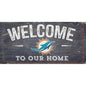 A Miami Dolphins Football and My Dog sign that reads "welcome to our home" with a Miami Dolphins logo in the center.