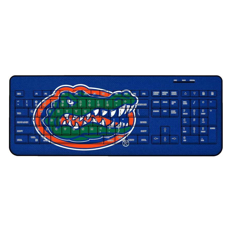 A blue FLORIDA GATORS SOLID WIRELESS USB KEYBOARD featuring a graphic of an open-mouthed alligator in green and orange, superimposed over the keys.