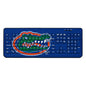 A blue FLORIDA GATORS SOLID WIRELESS USB KEYBOARD featuring a graphic of an open-mouthed alligator in green and orange, superimposed over the keys.
