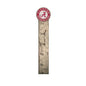 A wooden growth chart with a distressed finish, featuring a white scale in inches and topped with a circular university of alabama logo.