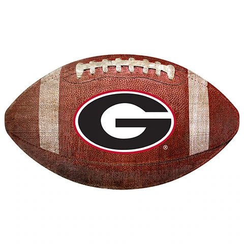 An american football with the university of georgia "g" logo in black and white centered on its side.