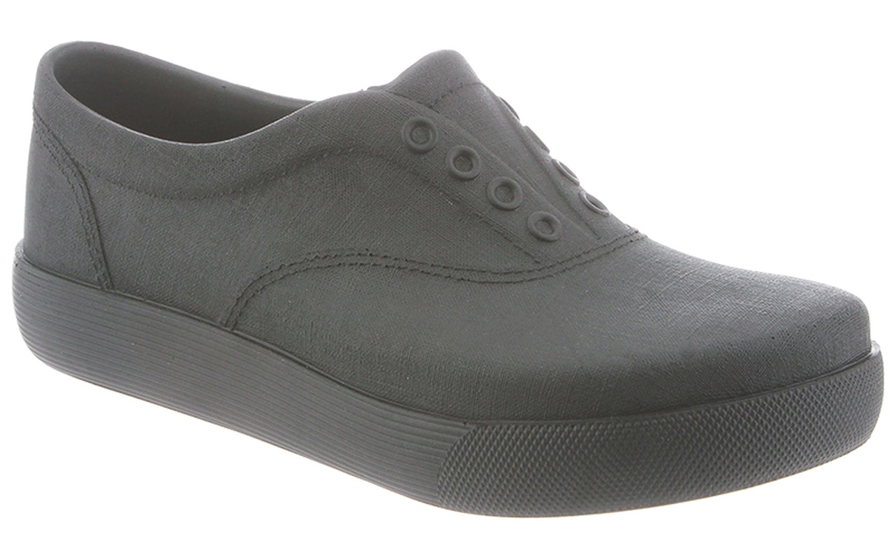 A single black canvas sneaker with a rubber sole and no visible laces, displayed against a white background.