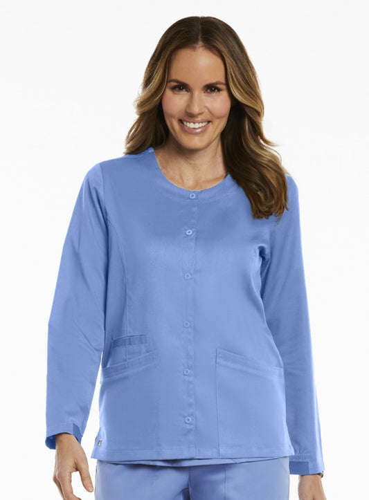 A woman in a 7701 Round Neck Snap Jacket smiles at the camera, with a plain white background.