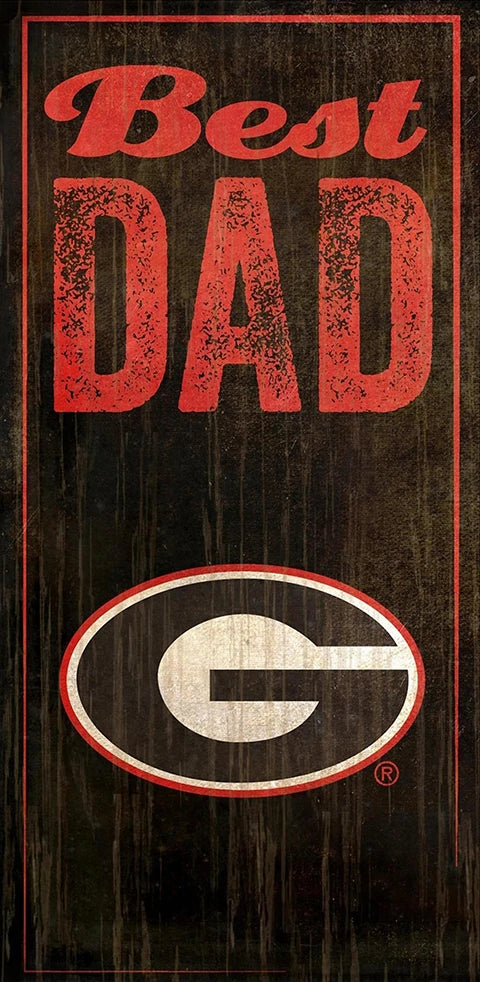 A vintage-style decorative sign reading "best dad" with a weathered georgia bulldogs logo in an oval, all against a dark, distressed wooden background.