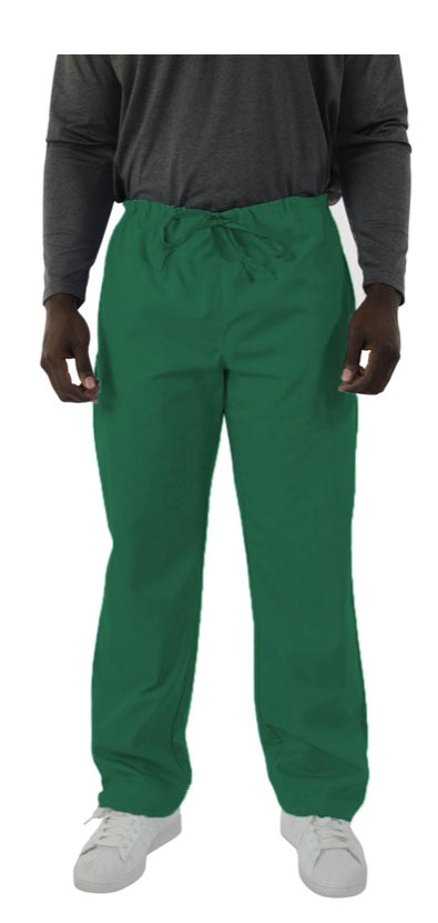 Man in grey sweatshirt and green drawstring pants standing with hands at his sides, wearing white sneakers.