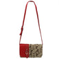 A red and beige Navajo 8588 ALABAMA crossbody bag with a prominent logo pattern and an adjustable strap.
