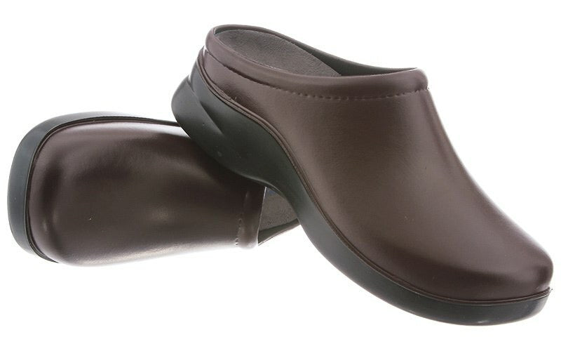 A pair of dusty brown leather clogs with black soles, displayed against a white background.