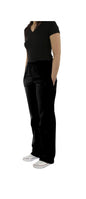 Woman standing in a relaxed pose, wearing a black v-neck t-shirt and UltraSoft Unisex Classic Elastic Waist Scrub Pants 300C with pockets, paired with white sneakers.