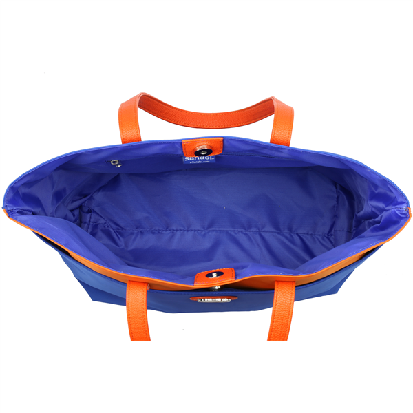 Open The Phyllis Handbag (University of Florida Gators) with bright orange handles on a white background. the interior is visible, showing a spacious, unoccupied main compartment.