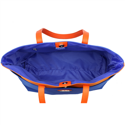 Open The Phyllis Handbag (University of Florida Gators) with bright orange handles on a white background. the interior is visible, showing a spacious, unoccupied main compartment.