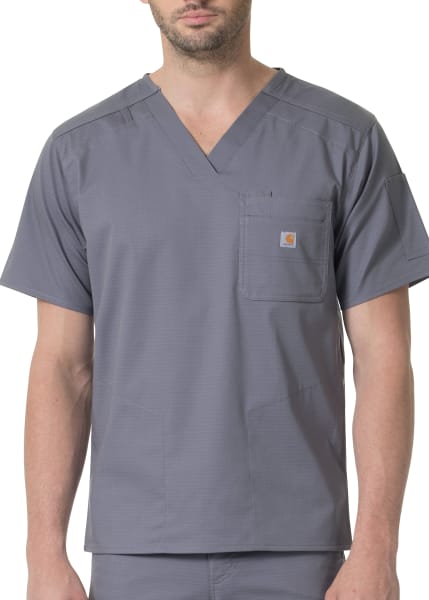 A man wearing a Gray Slim Fit 6 Pocket Top (Men's C16418) with a v-neck and a small logo on the chest pocket.
