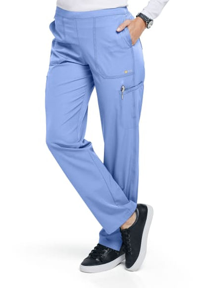 Person wearing FLAT FRONT STRAIGHT LEG PANT C52106 and black sneakers, standing with one leg slightly lifted, visible from the waist down.