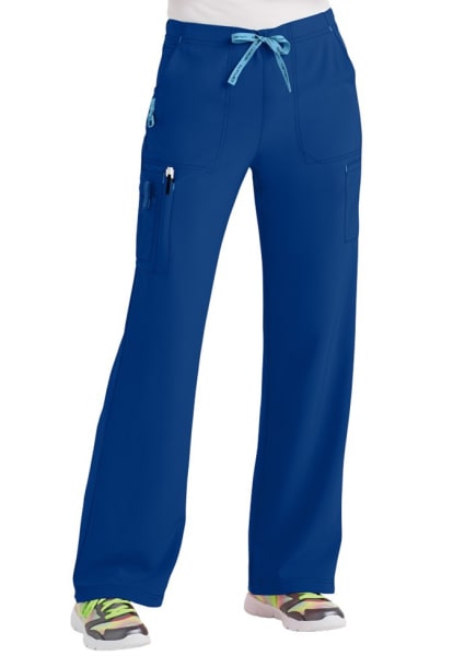 CROSS FLEX UTILITY BOOT CUT SCRUB PANT C52110 with multiple pockets and a drawstring, displayed on a mannequin with visible multicolored sneakers.