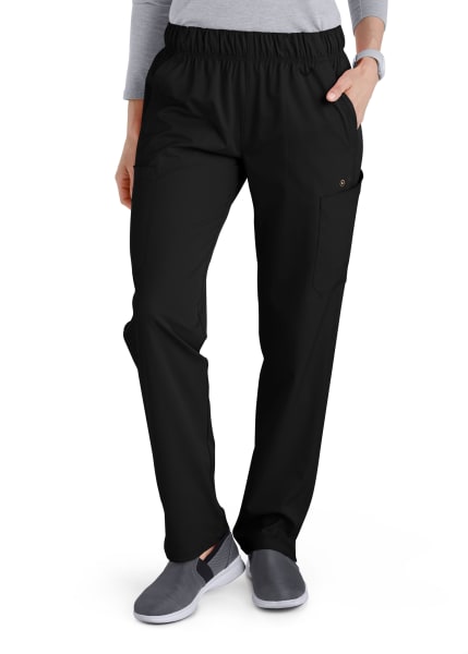 Woman standing in Comfort Waist Utility Cargo Pants with a side pocket, paired with grey slip-on shoes.