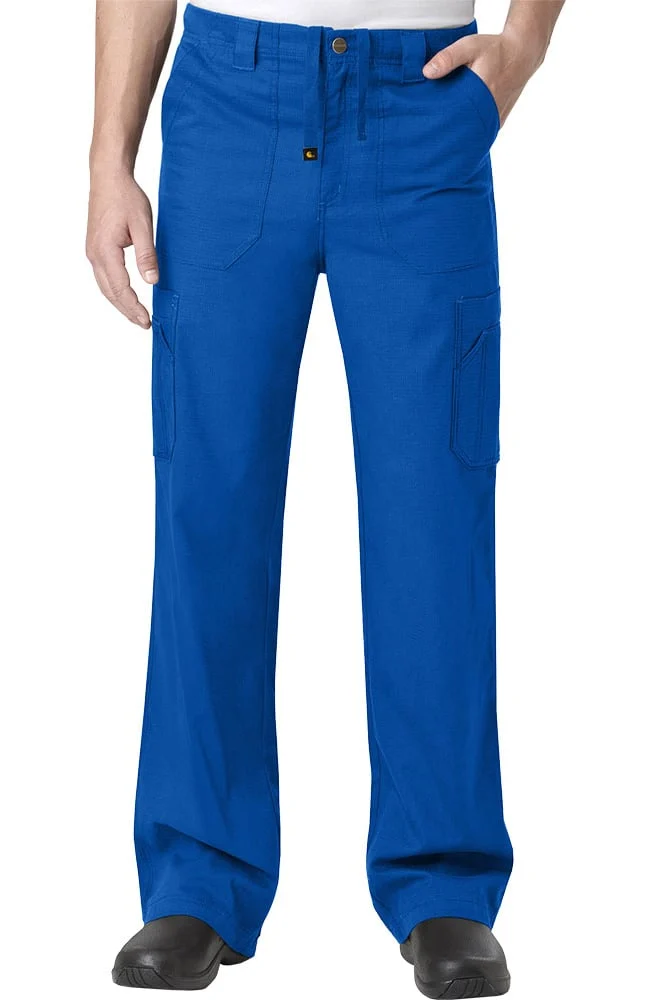 A person wearing blue cargo pants with pockets and black shoes, with hands partially inserted in front pockets.