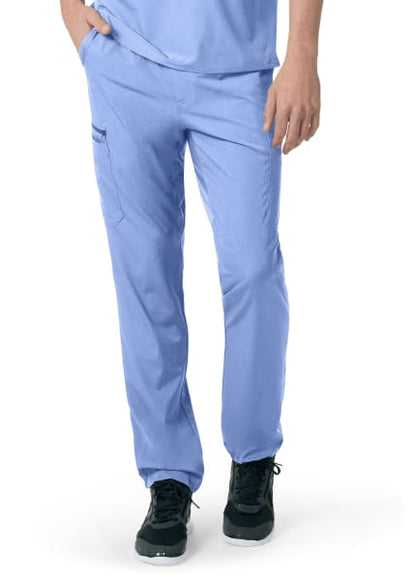 Person wearing CARHARTT C55106 - MEN'S ATHLETIC CARGO PANT and black shoes, standing with one hand slightly lifting the pant leg.