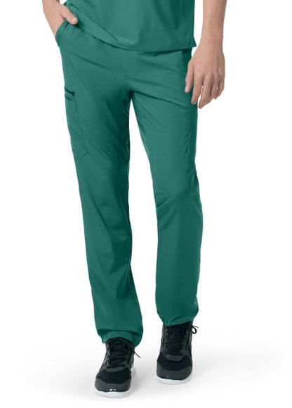 Person wearing CARHARTT C55106 - MEN'S ATHLETIC CARGO PANT and black sneakers, focusing on the lower half of the body.