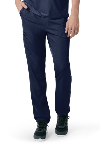 A pair of Carhartt C55106 - Men's Athletic Cargo Pants and dark green sneakers worn by a person, view focusing on the lower half of the body.