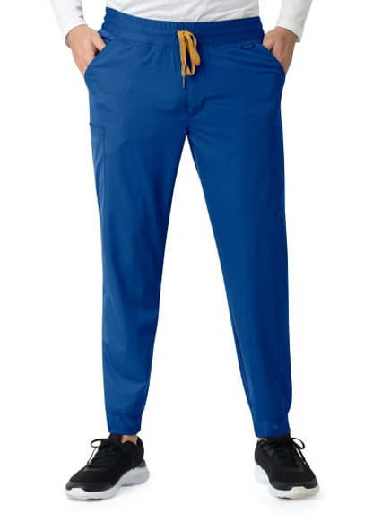 Man wearing Carhartt Liberty Men's Comfort Cargo Jogger Pants and black sneakers, cropped to show only from the waist down.