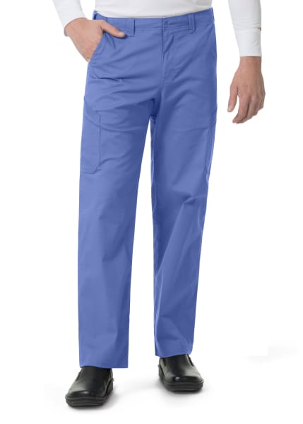 Man wearing Carhartt Ripstop Rugged Flex Straight Leg Cargo Pants (Men's C56418) and black shoes, hand in pocket, white background.