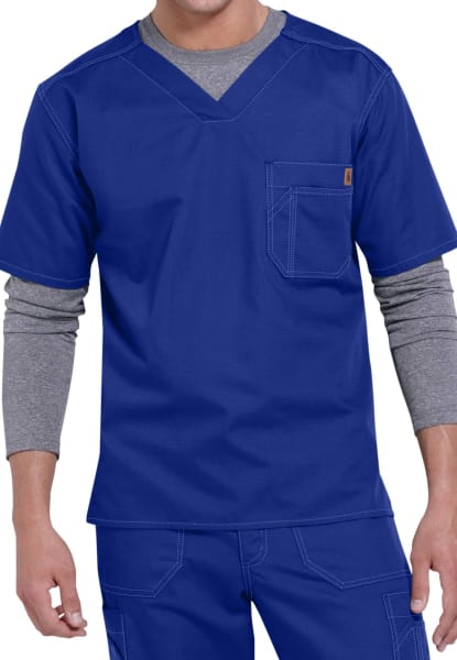 Man in a SOLID RIPSTOP SCRUB UTILITY TOP (Men's C15108) and gray undershirt, focusing on the upper half of his body.